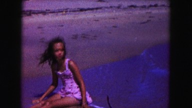 1960: sisters splashing in the ocean waves FLORIDA