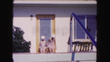 1960: two girls in swimsuits running toward the stairs FLORIDA