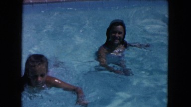 1960: kids swimming in a hotel pool FLORIDA