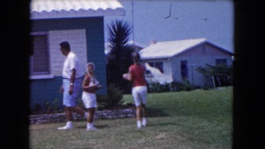 1960: suburban family at home in front of idealic home FLORIDA