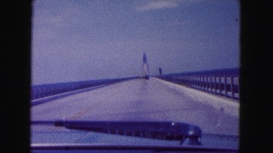 1960: a long bridge over water as seen from a moving vehicle FLORIDA