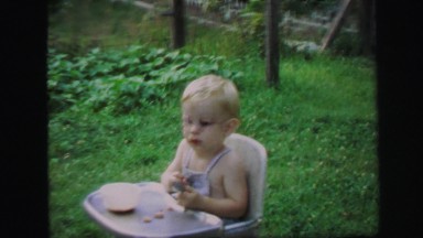 1972: Blonde Baby and Child Playing Outdoors in Lynbrook, New York
