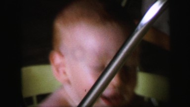 1972: cute redhead baby boy playing landry basket LYNBROOK, NEW YORK