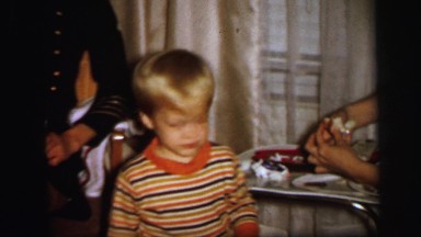 1972: mom is feeding her son LYNBROOK, NEW YORK