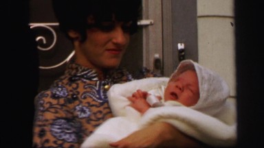 1972: Newborn Baby in Cradle with Parents in Lynbrook, New York