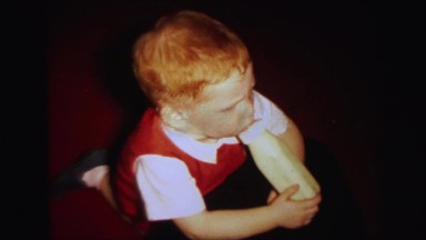 1972: funny blonde baby with nipple of the bottle in his mouth LYNBROOK