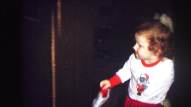 1974: kids in pajamas dancing around and hanging christmas stockings LYNBROOK