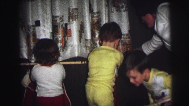1974: children hanging stockings for christmas LYNBROOK, NEW YORK