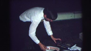 1974: two older kids opening various christmas presents LYNBROOK, NEW YORK