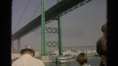1966: Tourists on Boat Pass Underneath Famous Bridge While Touring with Family