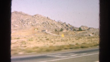 1966: desert and rugged mountain range as seen from moving vehicle CALIFORNIA