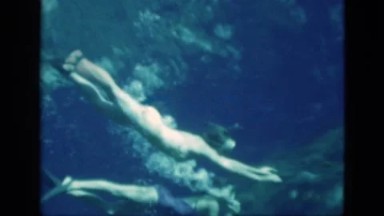 1952: Two Women Swimming Underwater Without Air Tanks While Wearing Flippers