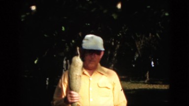 1952: man outdoor clothes talking suit walking garden loving CAMDEN, NEW JERSEY