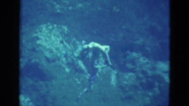 1952: two ladies performing a dance underwater using air tanks