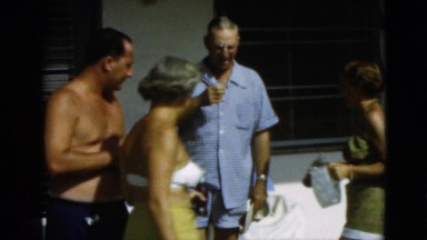 1952: four adults in beach attire are sunbathing while choosing drinks CAMDEN