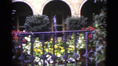 1952: a small fountain in the garden in front of an elegant building CAMDEN