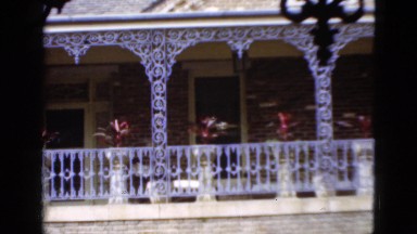 1952: building banner trees brick wall fence white huge CAMDEN, NEW JERSEY
