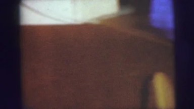 1974: Two Young Boys Seated on Floor Playing Miniature Ping Pong Camden
