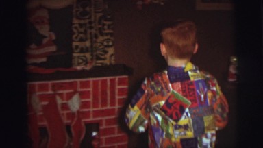 1974: Redheaded Child Hangs Christmas Stocking on Fireplace Camden, New Jersey