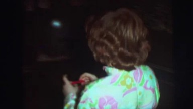 1974: a cute funny boy is decorating his christmas cap CAMDEN, NEW JERSEY