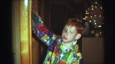 1974: two brothers one sister touch icon cross themselves and recite prayers
