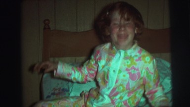 1974: children preparing to sleep beds pajamas CAMDEN, NEW JERSEY