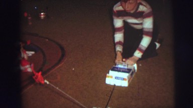 1974: a cute young boy on the floor playing with a helicopter CAMDEN, NEW JERSEY