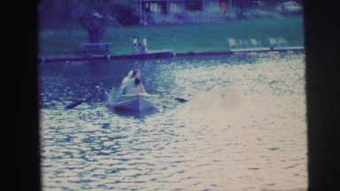 1974: people rowing a boat in a pond located in a large park CAMDEN, NEW JERSEY