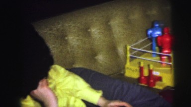 1974: two young boys on a couch playing with the toy rockem sockem robots