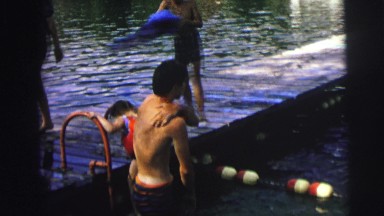 1974: kids drying off on a dock after swimming in what appears to be a lake