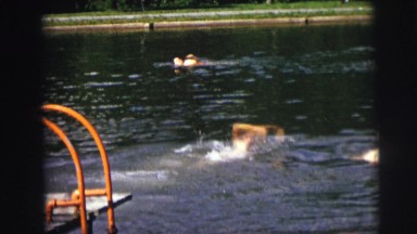1974: kid swimming pool freestyle move fast water waves INDIANA
