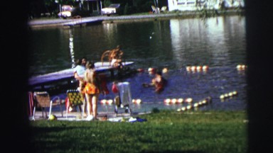 1974: children at a lake, swimming and feeding ducks CLARKSON, NEBRASKA