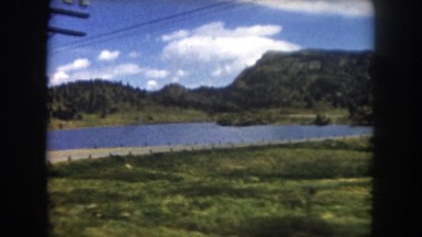 1962: road near to a lake in a mountain landscape COLORADO