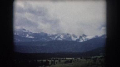 1962: snow capped mountains as viewed from a moving vehicle NEW YORK