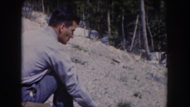 1962: man sitting on a hill CLARKSDALE, ARIZONA