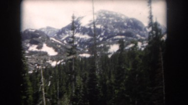 1962: a view of snowy mountains CLARKSDALE, ARIZONA