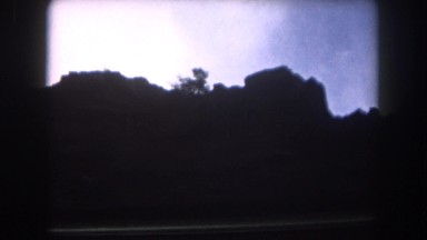 1962: the silhouette of a mountain ridge as seen from a moving vehicle DILLER