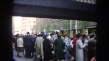 1962: people on the street at the street everyone and anyone staying and talking