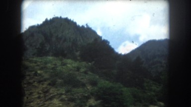 1962: a beautiful mountain ridge as seen through the window of a moving vehicle