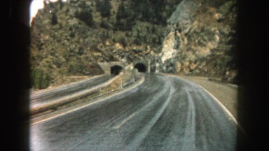 1962: entering mountain tunnel on wet roadway during rainy day MINNESOTA