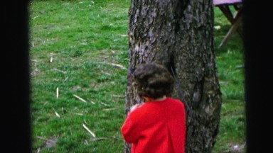 1964: children during easter egg hunt in backyard happily find eggs CAMDEN