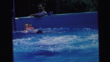 1964: kids are swimming and having fun at the pool CAMDEN, NEW JERSEY