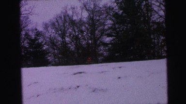 1964: kid is sliding down the snow hill CAMDEN, NEW JERSEY