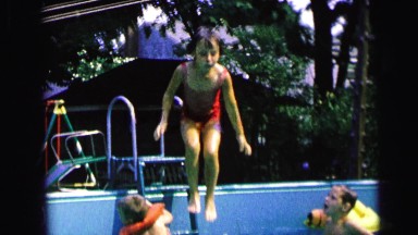1964: a little girl's big swimming pool splash CAMDEN, NEW JERSEY