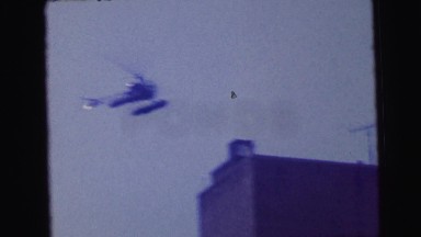 1964: several helicopters flying over buildings in an urban area CAMDEN