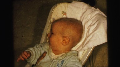 1964: hungry baby in chair wanting food it dropped CAMDEN, NEW JERSEY
