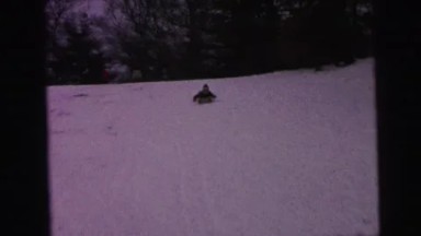 1964: Child Sledding Downhill Met by Mother at Bottom, Camden, New Jersey
