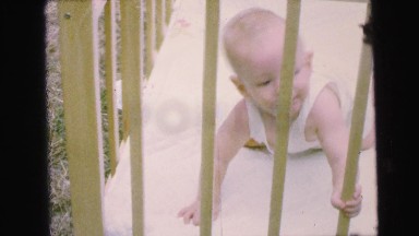 1964: baby in crib outdoor family time with fun loving mother CAMDEN, NEW JERSEY