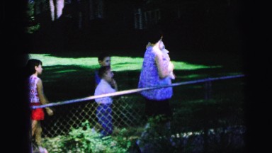 1964: woman with four kids walking down the gated sidewalk CAMDEN, NEW JERSEY