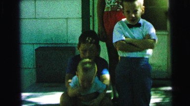 1964: several children outdoor posing on the front steps of a house CAMDEN